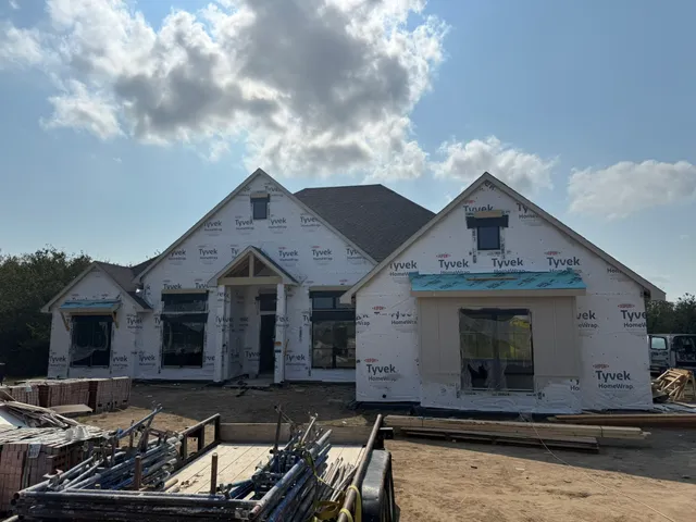 a front view of a house with yard