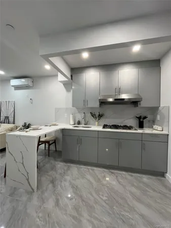a kitchen with a sink cabinets and window