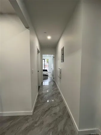 a view of hallway with livingroom