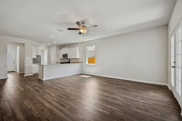 a view of a kitchen with a sink and a window