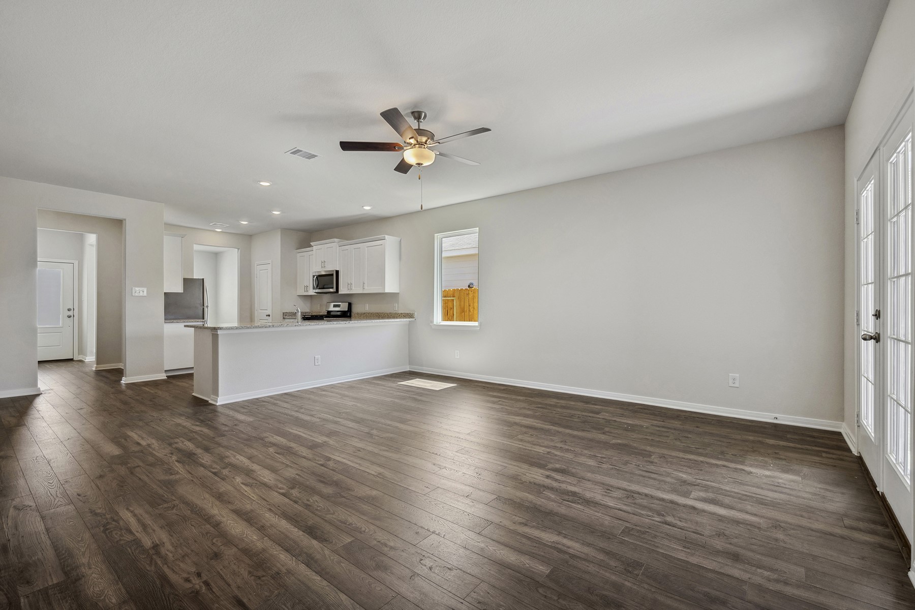 10422 Red Cardinal Drive Cleveland, TX 77328 - Photo 8 of 23 a view of a kitchen with a sink and a window
