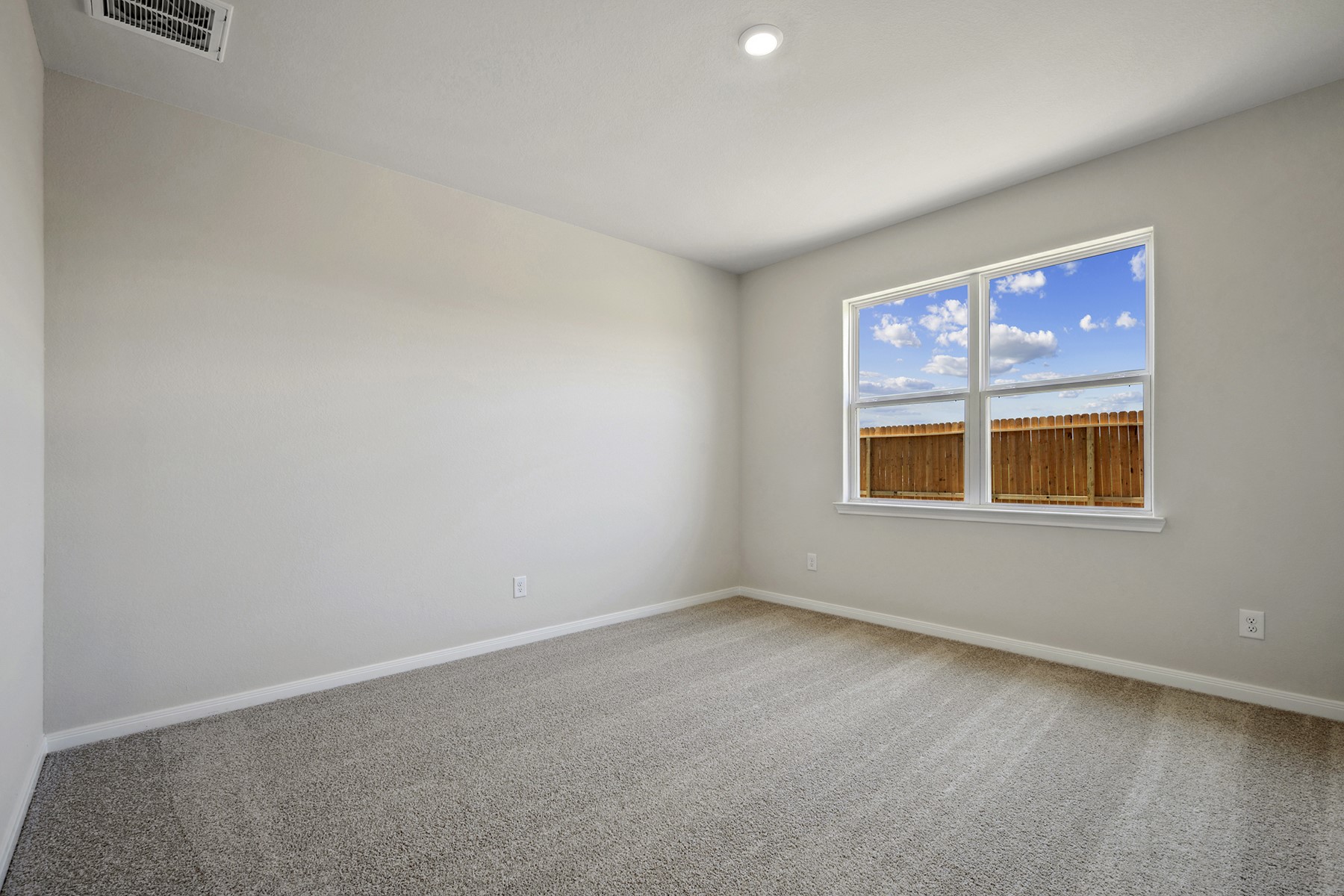 10422 Red Cardinal Drive Cleveland, TX 77328 - Photo 10 of 23 an empty room with a window