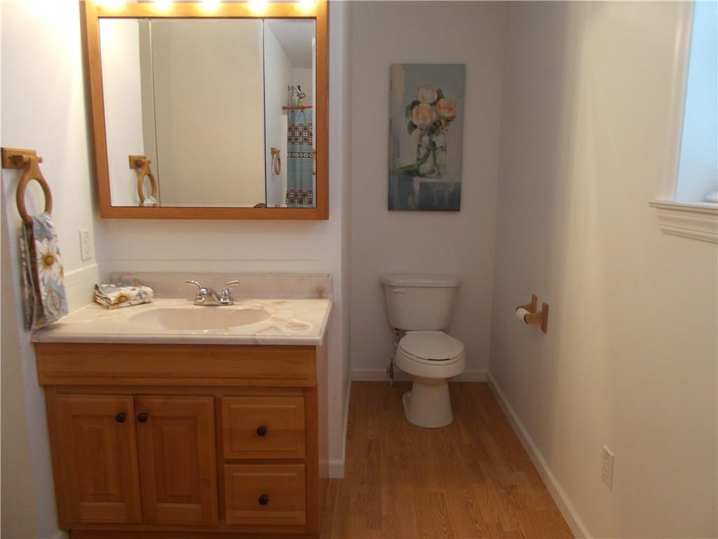 124 Currie Road Slippery Rock, PA 16057 - Photo 13 of 25 Full Bath. Upper Level. With honey oak vanity and laminate flooring.
