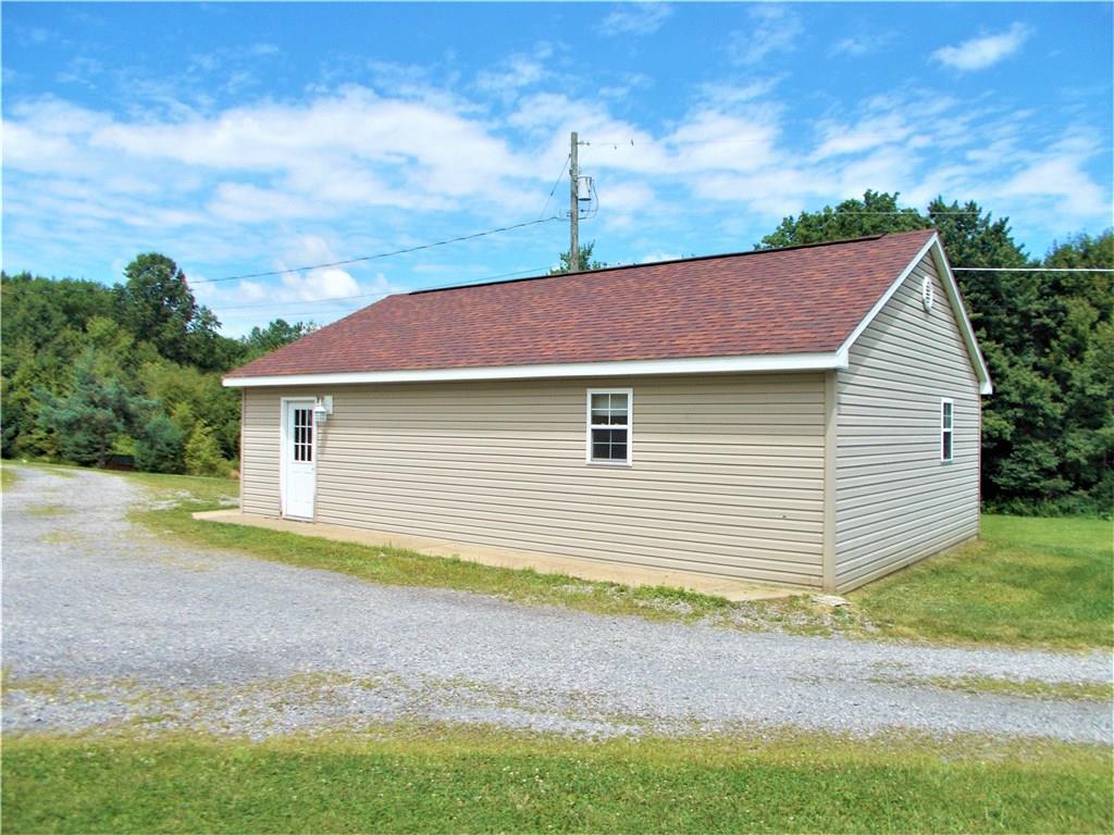 124 Currie Road Slippery Rock, PA 16057 - Photo 20 of 25 The detached garage can easily house three cars (and a forth, if you're skilled).
