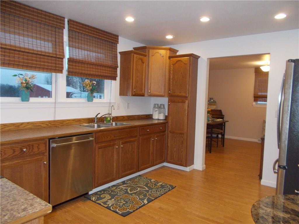 124 Currie Road Slippery Rock, PA 16057 - Photo 5 of 25 Fully equipped with Frigidaire flat-top electric stove and microwave, new Bosch Silence Plus dishwasher, and G.E. stainless steel side-by-side refrigerator with automatic ice dispenser.