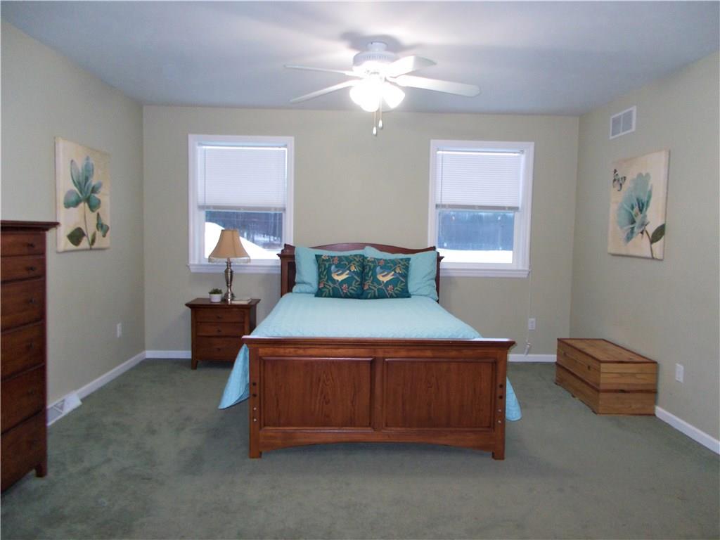 124 Currie Road Slippery Rock, PA 16057 - Photo 6 of 25 Master Bedroom. Main level, 14x20. This generously-sized room is located next to the kitchen and can accommodate all furniture sizes with added space for a seating area as well. With three large windows and ceiling fan. A master bath and walk-in closet abut.