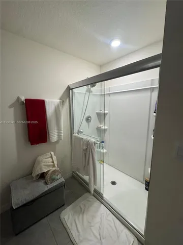 a kitchen with stainless steel appliances a sink stove and refrigerator