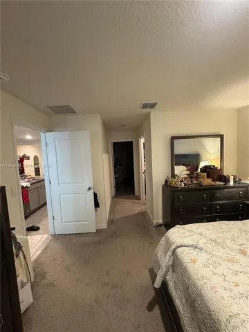 a white toilet sitting next to a sink