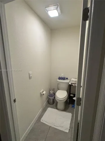 a room with a washing machine and appliances