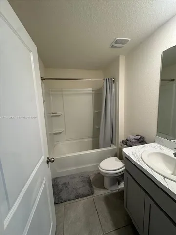 a room with furniture a rug and a window