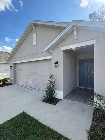a front view of a house with a garage