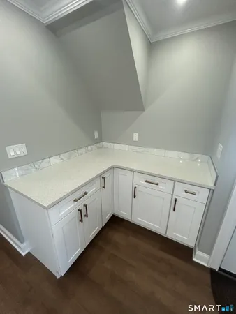 a kitchen with white cabinets