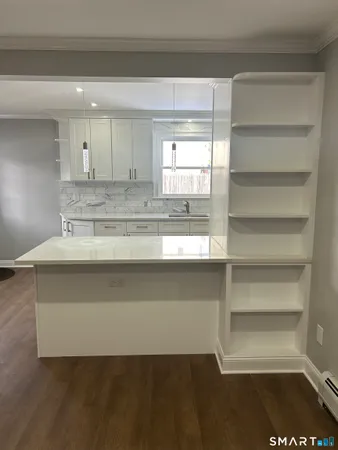 a bathroom with a sink a mirror and a window
