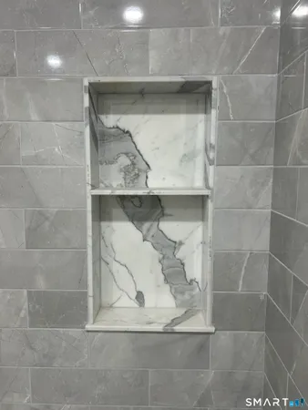 a bathroom with a tub and a shower