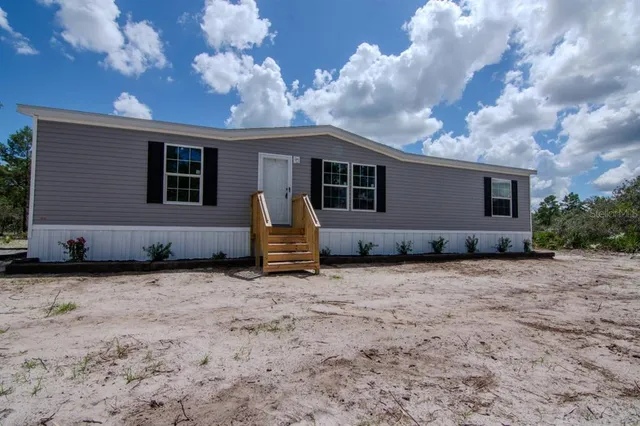 a backyard of a house with seating space