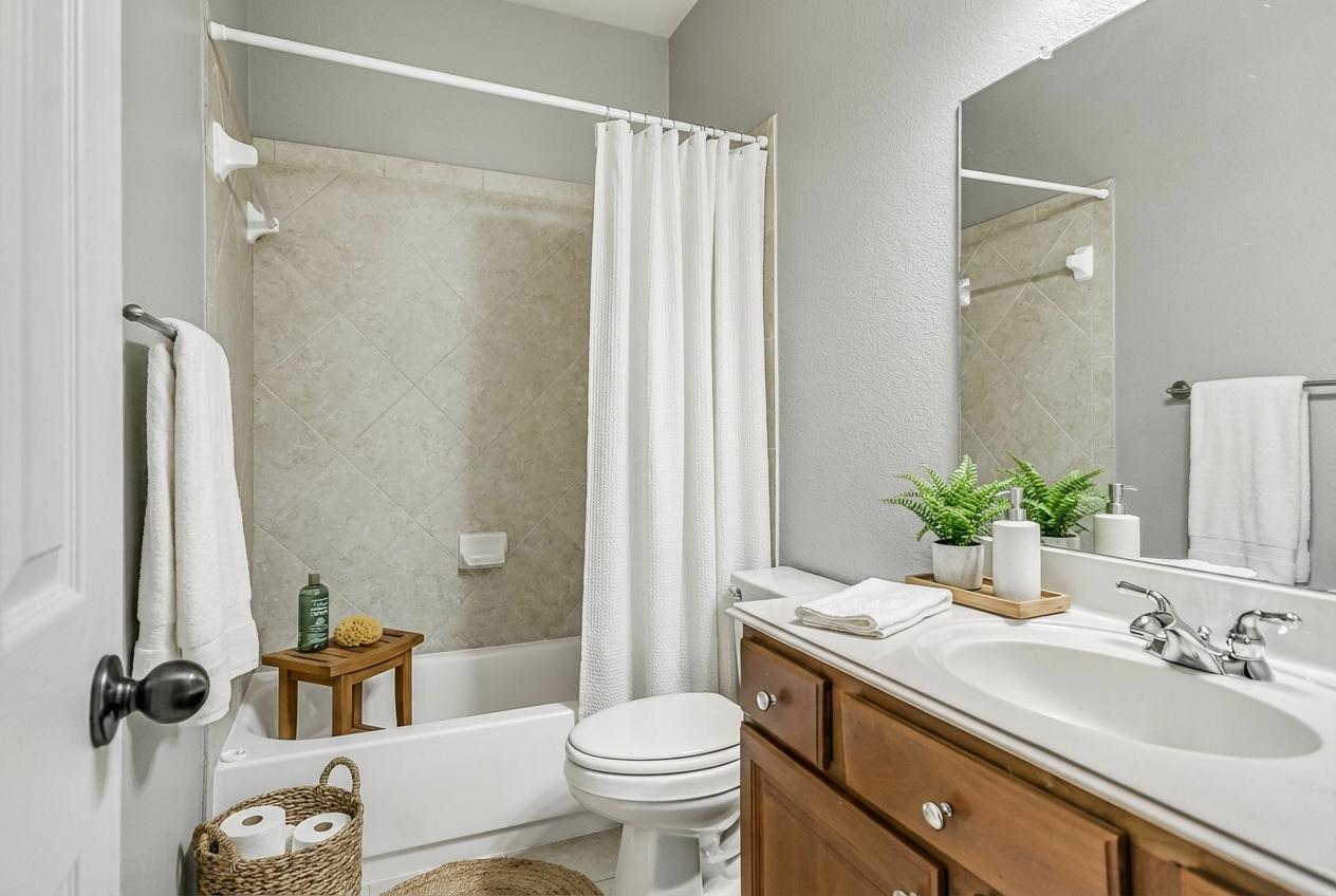 7416 Brecourt Manor Way Austin, TX 78739 - Photo 14 of 21 a bathroom with a sink toilet and shower