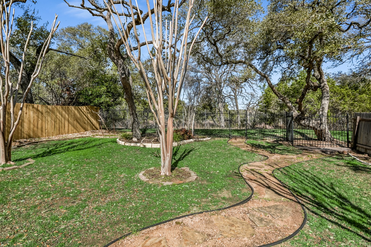 7416 Brecourt Manor Way Austin, TX 78739 - Photo 2 of 21 a view of a garden with a slide