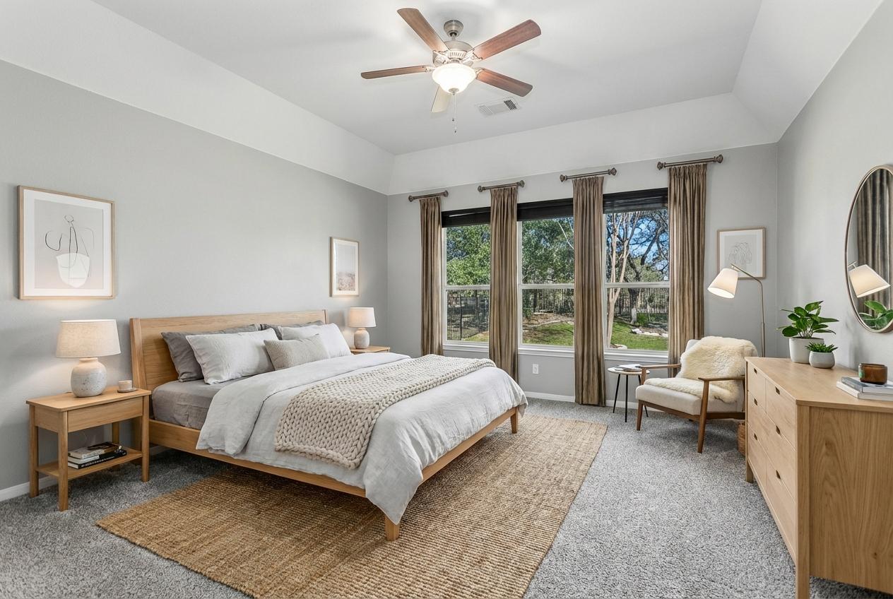 7416 Brecourt Manor Way Austin, TX 78739 - Photo 10 of 21 a bedroom with a large bed and a large window