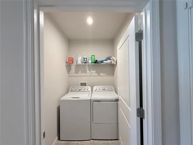 a utility room with dryer and washer