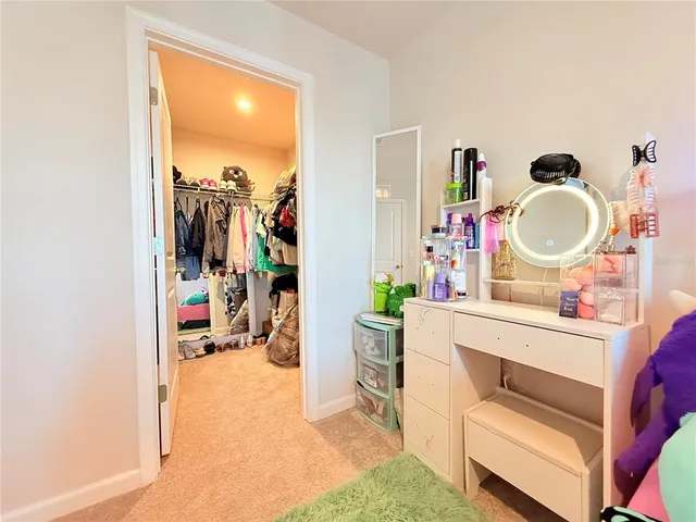 a room with furniture and a mirror