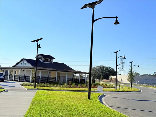 a view of swimming pool with a garden and trees