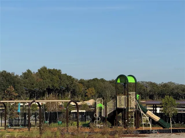 a view of houses with outdoor space and swimming pool