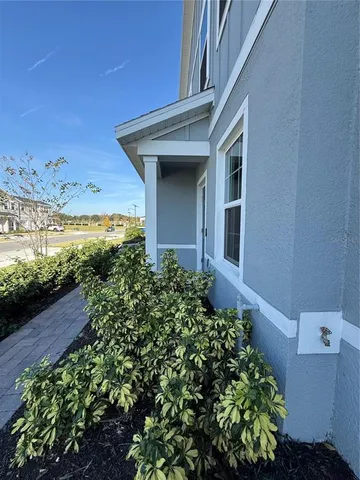 a view of a house with a flower garden