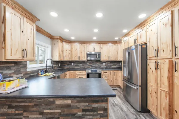 a living room with furniture and a fireplace