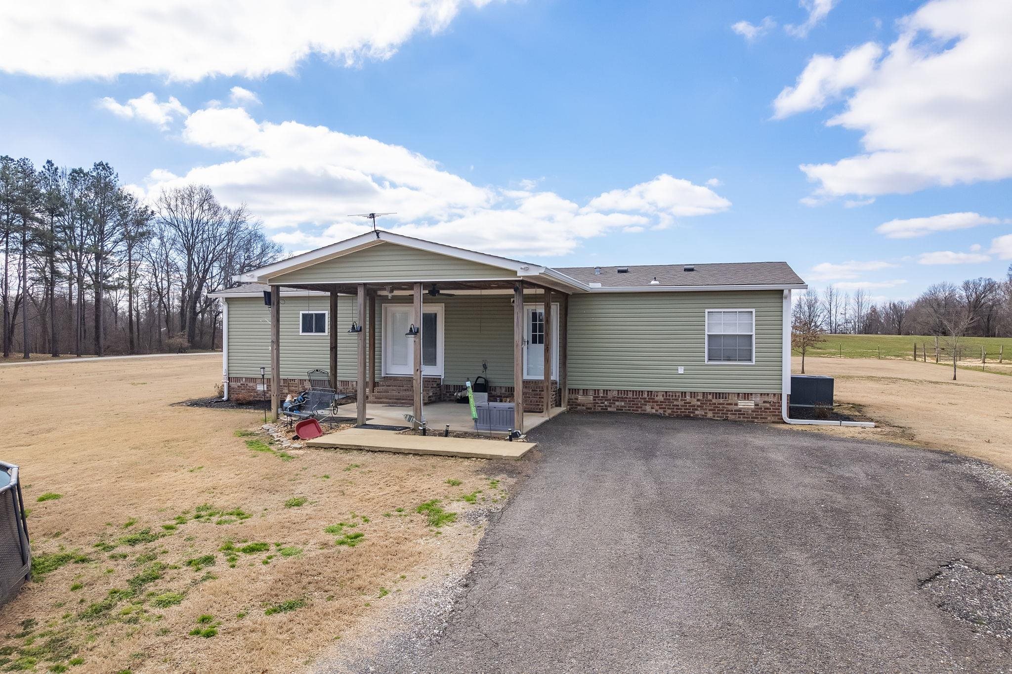 2656 Curve Woodville Road Ripley, TN 38063 - Photo 12 of 39 a view of a house with backyard porch and sitting area