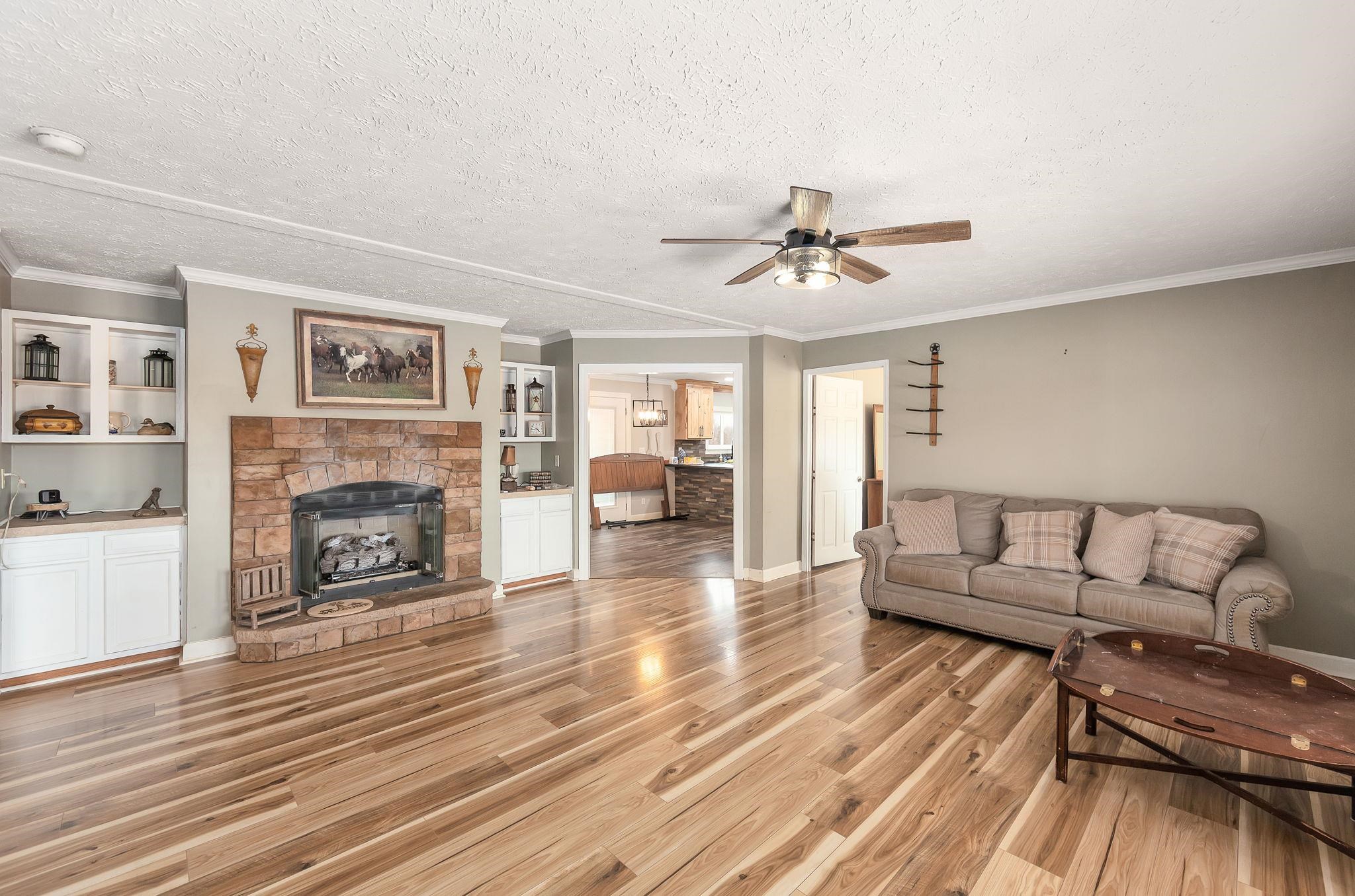 2656 Curve Woodville Road Ripley, TN 38063 - Photo 2 of 39 a living room with furniture and a fireplace