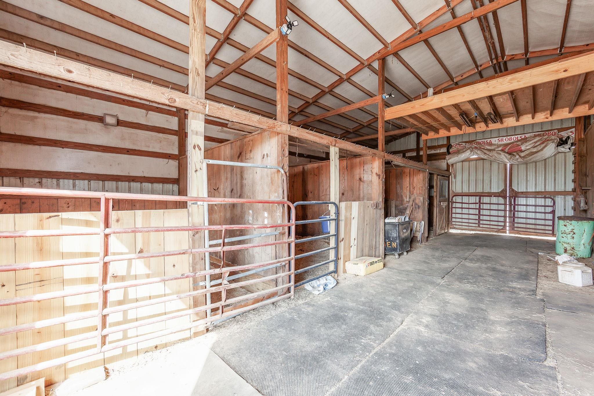 2656 Curve Woodville Road Ripley, TN 38063 - Photo 22 of 39 a view of an empty room with racks on the wall