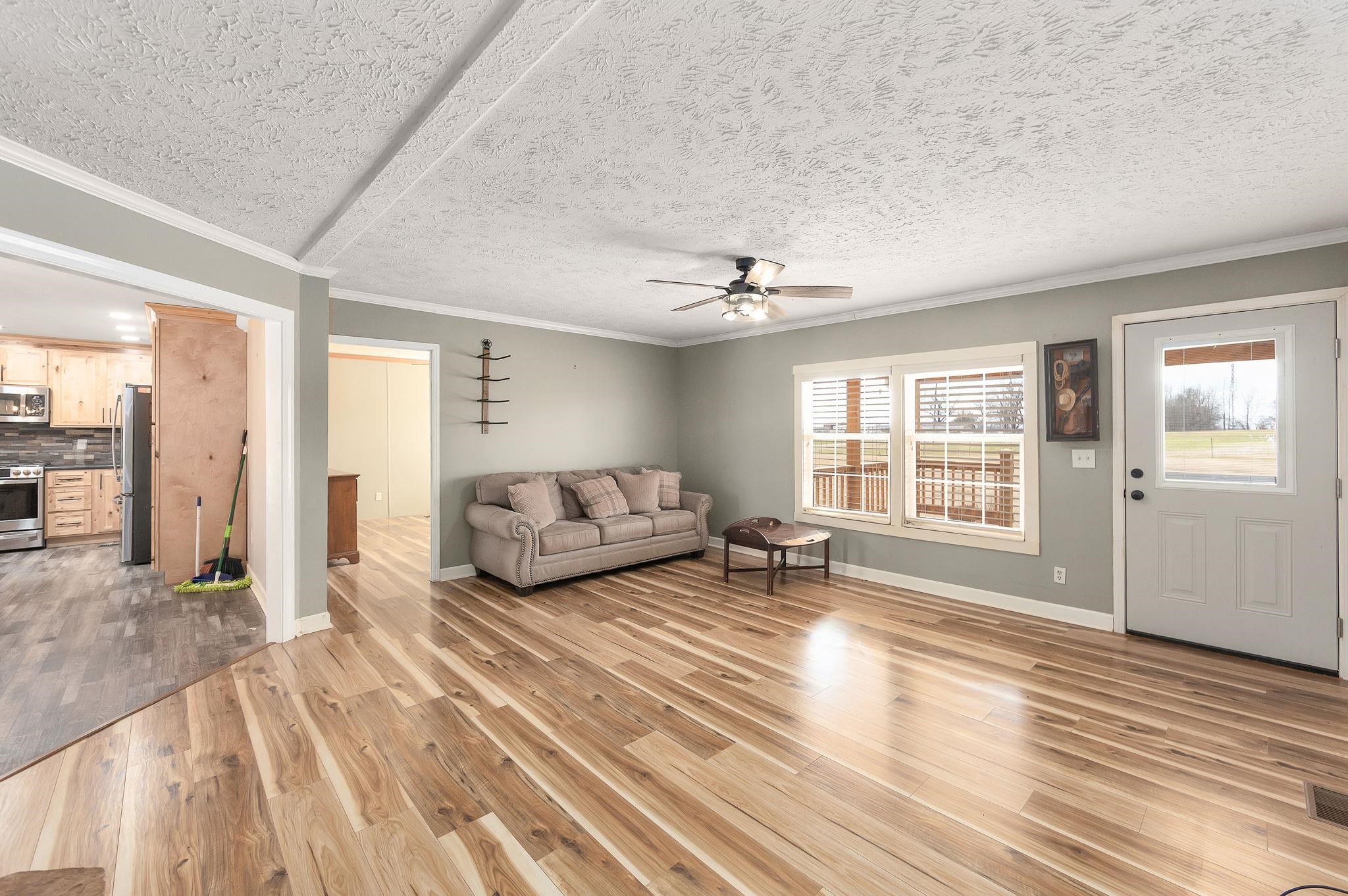 2656 Curve Woodville Road Ripley, TN 38063 - Photo 5 of 39 a spacious bedroom with a bed a couch and large window