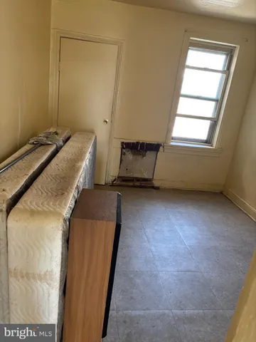 a room with a bed and a window