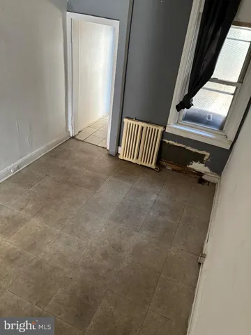 a view of an empty room with stairs