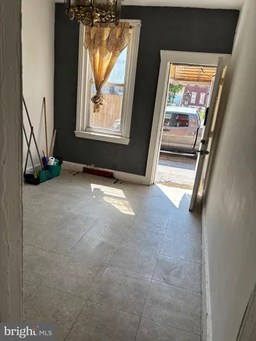 a view of an empty room and window