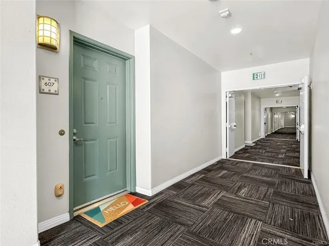 a bedroom with sliding door and windows