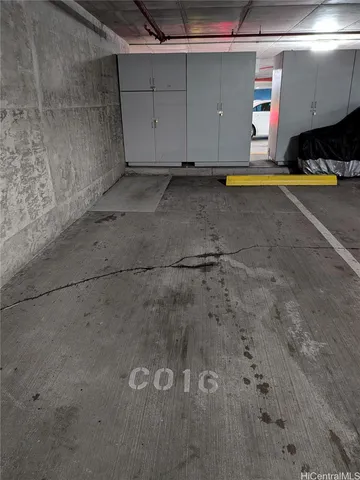 a view of a room with wooden floor and a fireplace