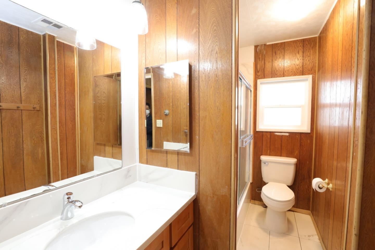 2151 Oakland Road, Unit 119 San Jose, CA 95131 - Photo 9 of 15 a bathroom with a granite countertop sink toilet and shower