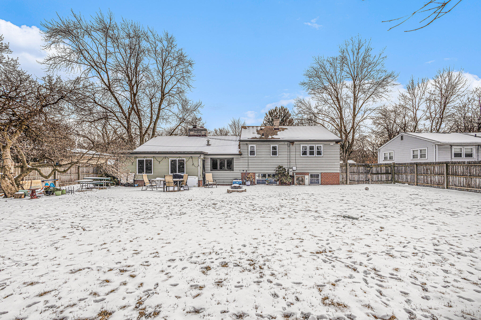 1511 Park Drive Munster, IN 46321 - Photo 2 of 23 a view of a white house with a snow on the road