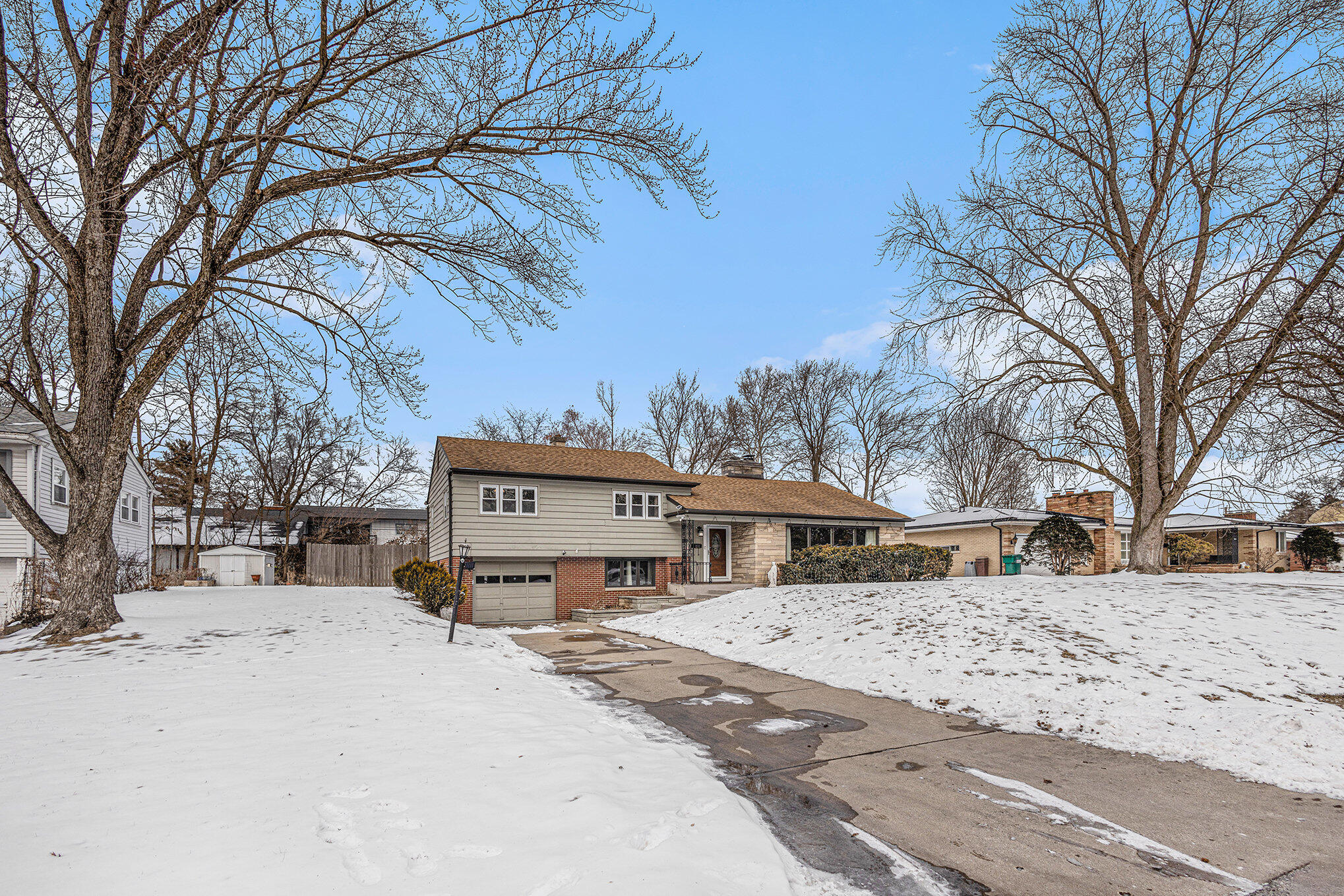 1511 Park Drive Munster, IN 46321 - Photo 21 of 23 a front view of a house with a yard covered in snow