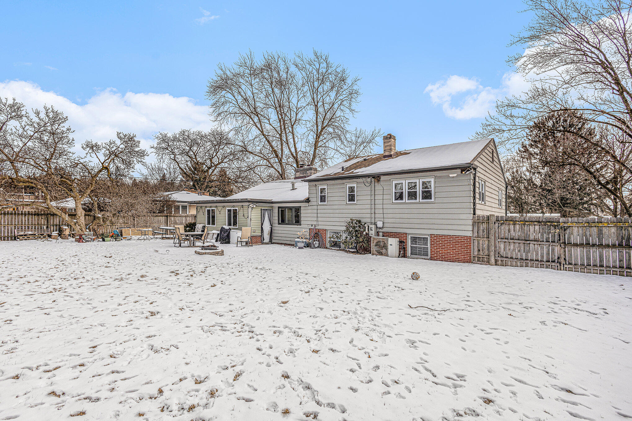 1511 Park Drive Munster, IN 46321 - Photo 22 of 23 a front view of a house with a yard covered in snow