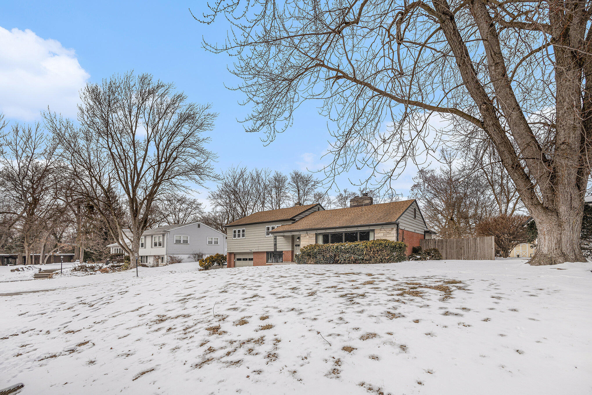 1511 Park Drive Munster, IN 46321 - Photo 23 of 23 a front view of a house with a yard covered in snow