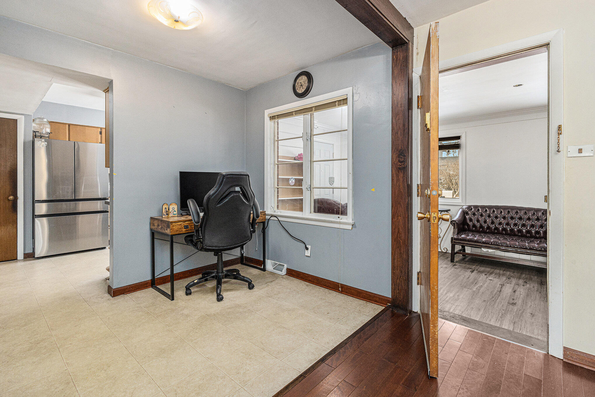 1511 Park Drive Munster, IN 46321 - Photo 8 of 23 a view of a workspace with furniture and a window