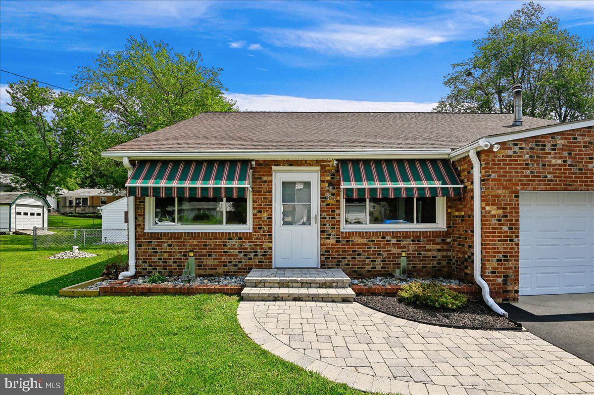 1731 Tacoma Road Edgewater, MD 21037 - Photo 5 of 59 Charming brick home with vibrant awnings.