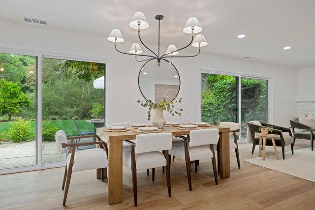a view of a dining room with furniture window and outside view