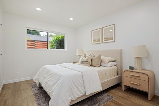 a bedroom with a bed and a couch