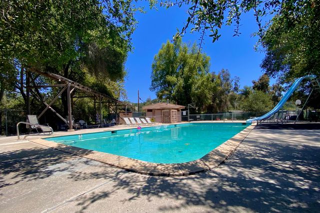 a view of a playground with a swimming pool