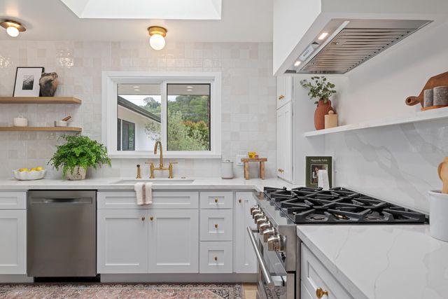 a kitchen with a stove and a sink