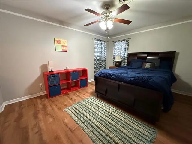 a bedroom with a bed and dresser