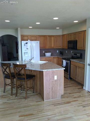 9275 Rockingham Drive Peyton, CO 80831 - Photo 7 of 26 New Granite Countertops in Kitchen.